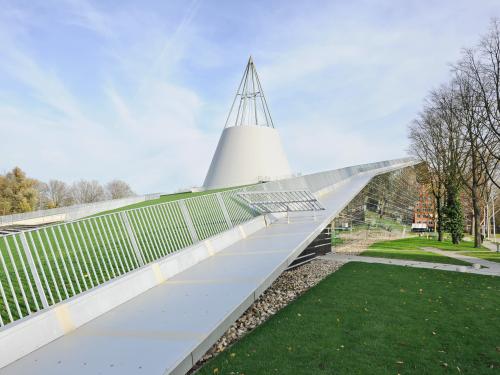 Pitched green roof with lawn and railing